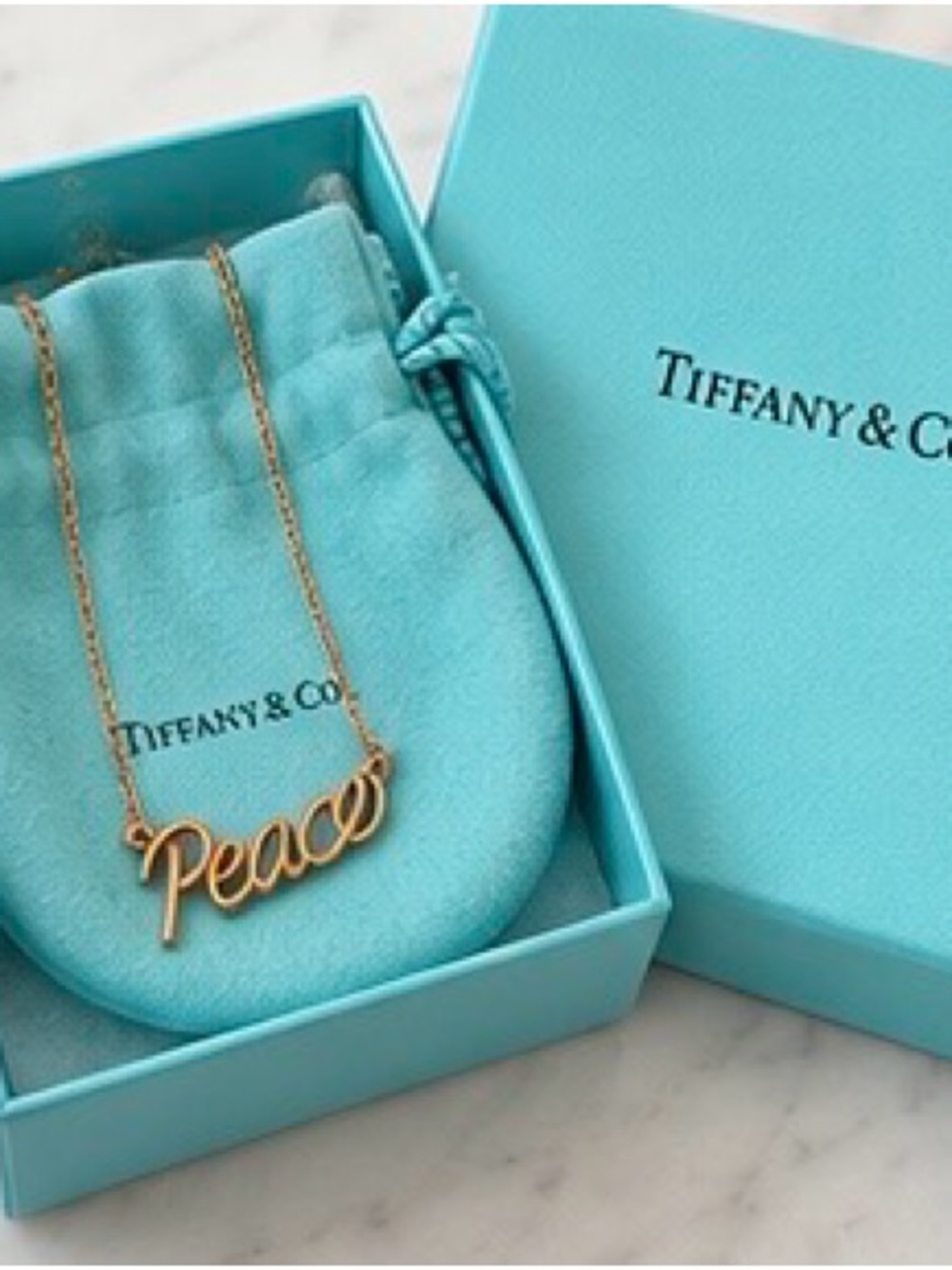 Tiffany and Co Paloma Picasso Graffiti Peace Necklace 18kt gold